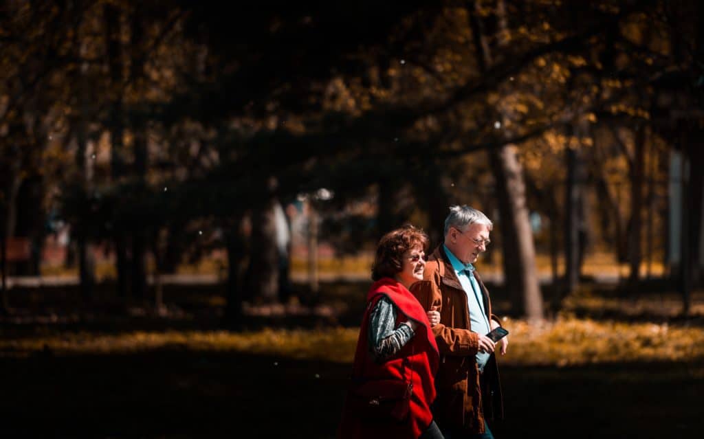 older couple walking in nature