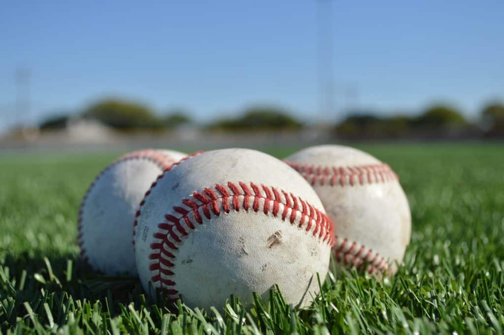 baseballs on grass