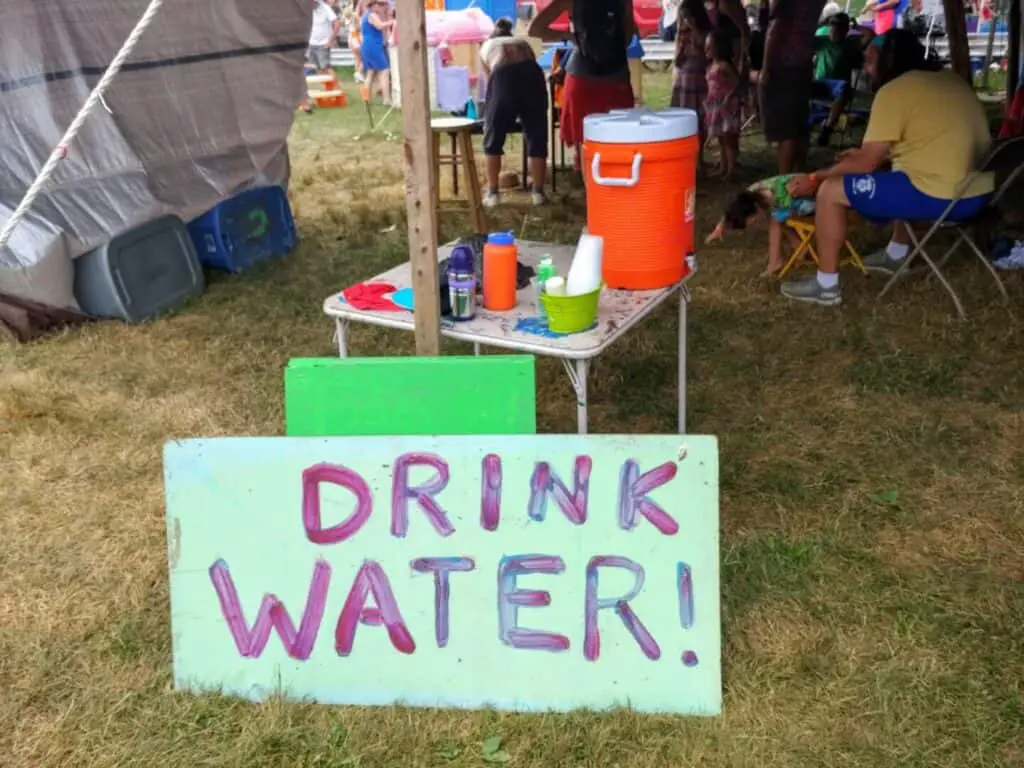 water station with sign saying drink water