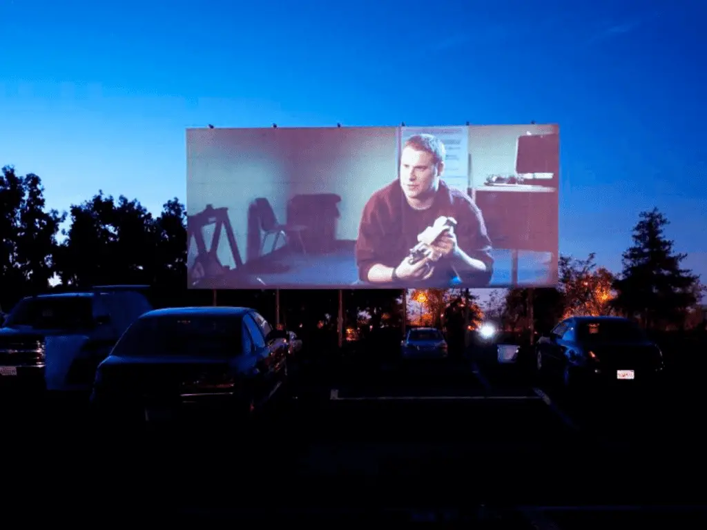 drive-in movie screen with cars