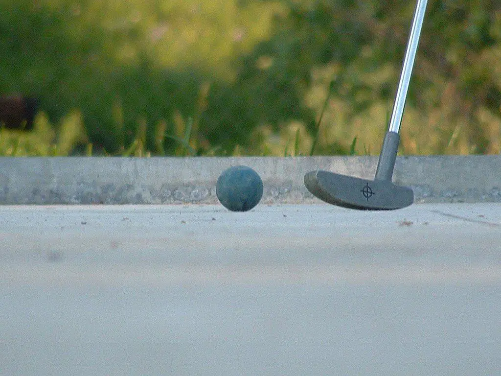 miniature golf ball and club