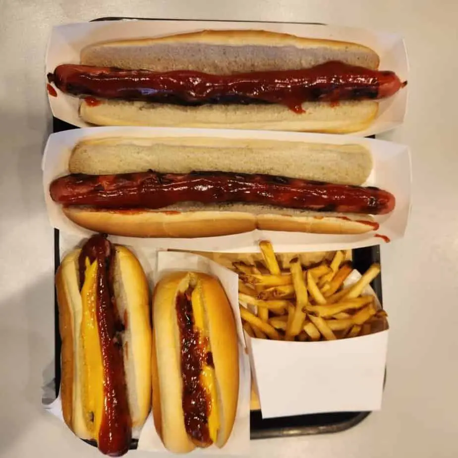 four hot dogs and fries