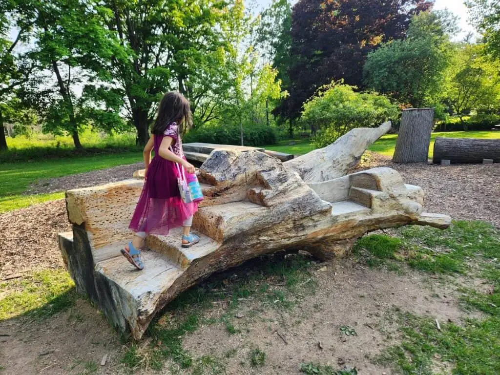 girl on natural playground