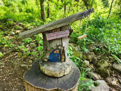 small fairy house with sign