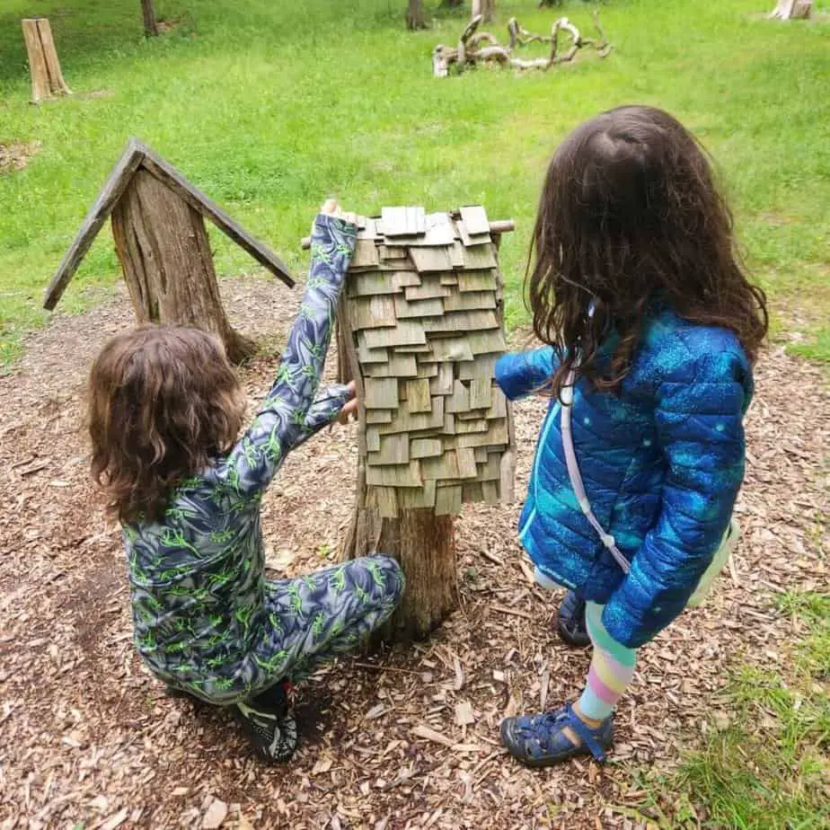 two children with fairy house